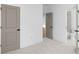 Bedroom featuring carpet, a gray door, and an ensuite bathroom at 3255 Hilltop Cir, Marietta, GA 30066