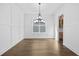 Elegant dining room with hardwood floors, wainscoting, and a modern chandelier at 3255 Hilltop Cir, Marietta, GA 30066