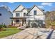 Beautiful two-story home with a two-car garage, lush lawn and a welcoming front porch at 3255 Hilltop Cir, Marietta, GA 30066