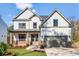 Charming two-story home with a well-manicured lawn and a cozy front porch at 3255 Hilltop Cir, Marietta, GA 30066