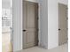 Hallway with interior doors, trim, and neutral walls, showcasing modern design elements at 3255 Hilltop Cir, Marietta, GA 30066