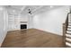 Living room with built-in white shelving surrounding a fireplace and a trey ceiling at 3255 Hilltop Cir, Marietta, GA 30066