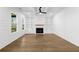 Bright living room with large windows, built in shelving surrounding a fireplace and a trey ceiling at 3255 Hilltop Cir, Marietta, GA 30066