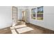 Sunlit office with French doors, wainscoting, hardwood floors, and large windows at 3255 Hilltop Cir, Marietta, GA 30066