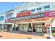 Historic Strand theater with marquee and decorative facade, located on a vibrant city street at 3255 Hilltop Cir, Marietta, GA 30066