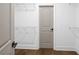 Walk-in closet features white wire shelving for ample storage and hardwood flooring at 3255 Hilltop Cir, Marietta, GA 30066