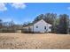 The home features a green metal roof and an expansive yard, perfect for outdoor activities and enjoyment at 60 Collins Rd, Carrollton, GA 30116