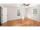 Inviting bedroom boasts hardwood floors, two windows, and ample natural light throughout the space at 60 Collins Rd, Carrollton, GA 30116