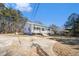 Charming curb appeal with a classic porch, driveway, and mature trees creates a welcoming feel at 60 Collins Rd, Carrollton, GA 30116