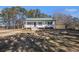 Charming one story home featuring a well-maintained lawn and inviting front porch at 60 Collins Rd, Carrollton, GA 30116