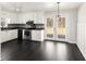 Modern kitchen featuring stainless steel appliances and access to backyard deck at 60 Collins Rd, Carrollton, GA 30116