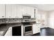 Open kitchen with stainless steel appliances and access to backyard deck at 60 Collins Rd, Carrollton, GA 30116