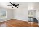 Bright living room with hardwood floors, white walls, and view of the backyard deck at 60 Collins Rd, Carrollton, GA 30116