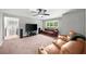 Entertaining bonus room features a ceiling fan, large tv, and lots of comfortable seating at 1605 Camden Cove Dr, Cumming, GA 30040