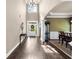 Bright, airy foyer with dark hardwood floors and views to dining and living areas at 1605 Camden Cove Dr, Cumming, GA 30040