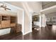 Open-concept living area with hardwood floors and seamless access to adjacent spaces at 1605 Camden Cove Dr, Cumming, GA 30040