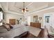 Serene Primary bedroom with a tray ceiling, hardwood floors, and ample natural light and view of ensuite at 1605 Camden Cove Dr, Cumming, GA 30040