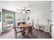 Bright office features ceiling fan, stylish window and furniture, plus neutral colored carpet at 1605 Camden Cove Dr, Cumming, GA 30040