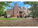 Serene backyard featuring a stone patio with fire pit at 4992 Price Dr, Suwanee, GA 30024
