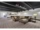 Spacious finished basement with a large leather sofa and a pool table at 4992 Price Dr, Suwanee, GA 30024