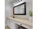 This is a bathroom with a sink, mirror, white floors, cabinets, and hardwood floors at 4992 Price Dr, Suwanee, GA 30024