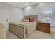 Bright bedroom features neutral tones, a large window with shutters and wood dresser at 4992 Price Dr, Suwanee, GA 30024
