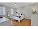 This is a bedroom with a blue bedspread, white floors, and hardwood floors at 4992 Price Dr, Suwanee, GA 30024