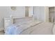 Bedroom featuring ensuite bathroom access, light colored walls and neutral bedding at 4992 Price Dr, Suwanee, GA 30024