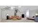 Large bonus room with spiral staircase, seating, and sleeping area at 4992 Price Dr, Suwanee, GA 30024
