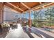 Relaxing covered patio with outdoor seating, ceiling fan, and string lights, perfect for entertaining or relaxing at 4992 Price Dr, Suwanee, GA 30024