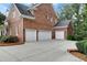 Spacious three car garage with ample driveway space at 4992 Price Dr, Suwanee, GA 30024