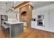 Gourmet kitchen with brick accents, stainless appliances, and large island for entertaining at 4992 Price Dr, Suwanee, GA 30024
