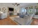 Bright living room with fireplace and views of the trees and neighborhood at 4992 Price Dr, Suwanee, GA 30024