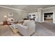 Living room with brick floors, adjacent kitchen, and comfortable seating at 4992 Price Dr, Suwanee, GA 30024