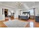 Inviting main bedroom with hardwood floors, fireplace, built-in shelves, and a seating area at 4992 Price Dr, Suwanee, GA 30024