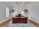 Bright office with coffered ceiling, floating shelves, and a large desk at 4992 Price Dr, Suwanee, GA 30024
