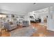 Bright sitting room next to the bedroom featuring built-in shelves and hardwood floors at 4992 Price Dr, Suwanee, GA 30024