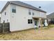 Two-story home featuring a covered patio, and a grassy backyard at 1159 Fort Marcy Park, Lawrenceville, GA 30044