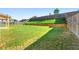 Large backyard with a wooden fence, and a covered patio at 1159 Fort Marcy Park, Lawrenceville, GA 30044