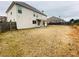Large backyard with a covered patio, a wooden fence, and a grassy area that needs some TLC at 1159 Fort Marcy Park, Lawrenceville, GA 30044