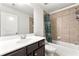 Stylish bathroom with a shower-tub combo and dark cabinets offering great storage at 1159 Fort Marcy Park, Lawrenceville, GA 30044