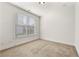Empty bedroom with carpet flooring, a large window, and neutral walls at 1159 Fort Marcy Park, Lawrenceville, GA 30044