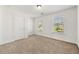 Neutral bedroom featuring two bright windows and a neutral toned carpet at 1159 Fort Marcy Park, Lawrenceville, GA 30044
