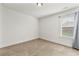 A simple bedroom is well-lit with bright, natural light from a window at 1159 Fort Marcy Park, Lawrenceville, GA 30044