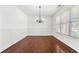Bright dining room with hardwood floors, wainscoting, and chandelier at 1159 Fort Marcy Park, Lawrenceville, GA 30044