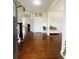 Inviting home entryway featuring hardwood floors, a staircase, and views of the formal dining room at 1159 Fort Marcy Park, Lawrenceville, GA 30044