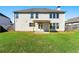 The back of the home features a two story exterior, white siding, and a well maintained lawn at 1159 Fort Marcy Park, Lawrenceville, GA 30044