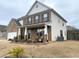 Lovely two-story home featuring a side entry garage, manicured landscaping, and a covered porch at 1159 Fort Marcy Park, Lawrenceville, GA 30044
