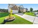 Two-story brick home featuring a two-car garage and well-maintained front yard at 1159 Fort Marcy Park, Lawrenceville, GA 30044