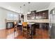 Gourmet kitchen boasts dark cabinetry, granite counters, and stainless steel appliances at 1159 Fort Marcy Park, Lawrenceville, GA 30044